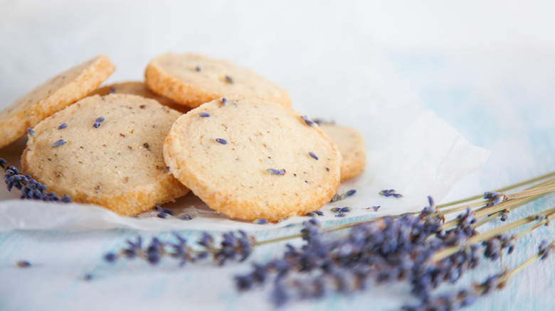 lavender shortbread cookies with herbs in foreground