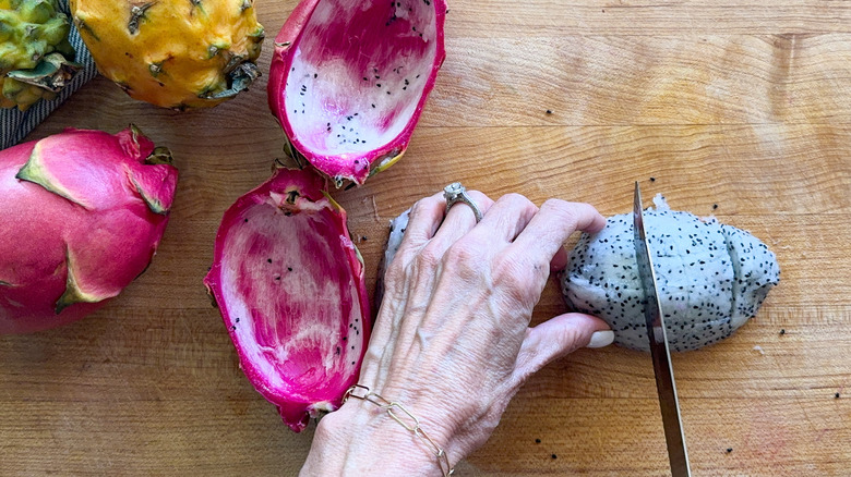 hand cutting fruit cross wise