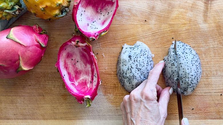 hand slicing dragon fruit