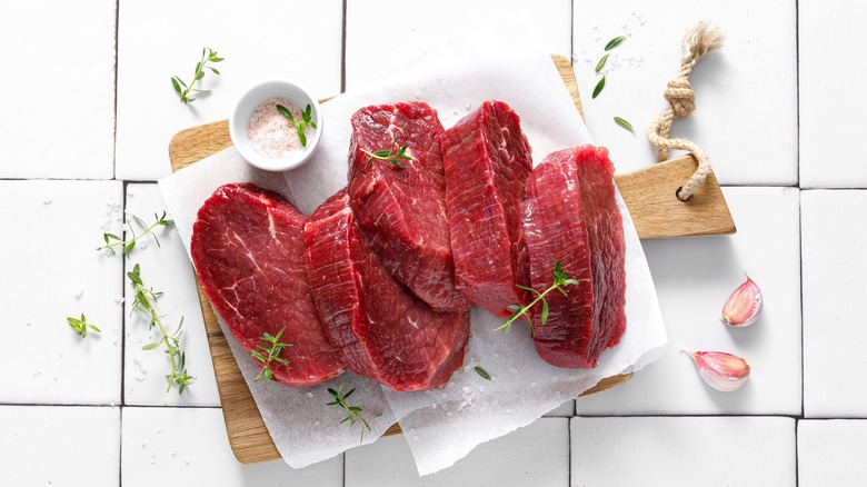 Raw beef tenderloin on plate