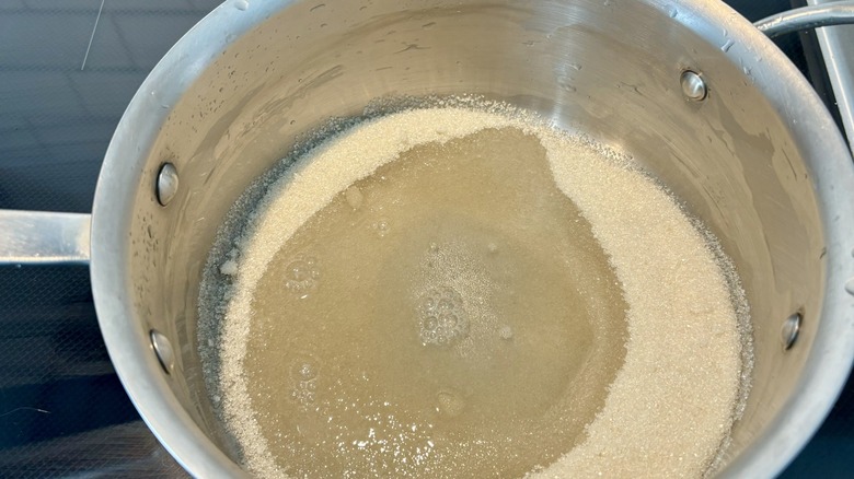 Sugar and water in pan