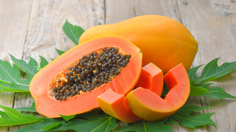 ripe whole and halved papaya