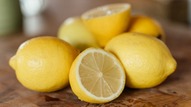 Lemons on cutting board ready for juicing