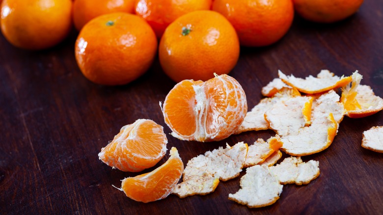 Peeled clementine on wooden table