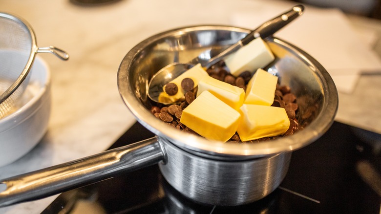 Melting chocolate and butter in a pot on the stove