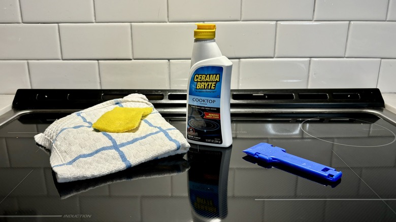 cleaning supplies on glass stove top