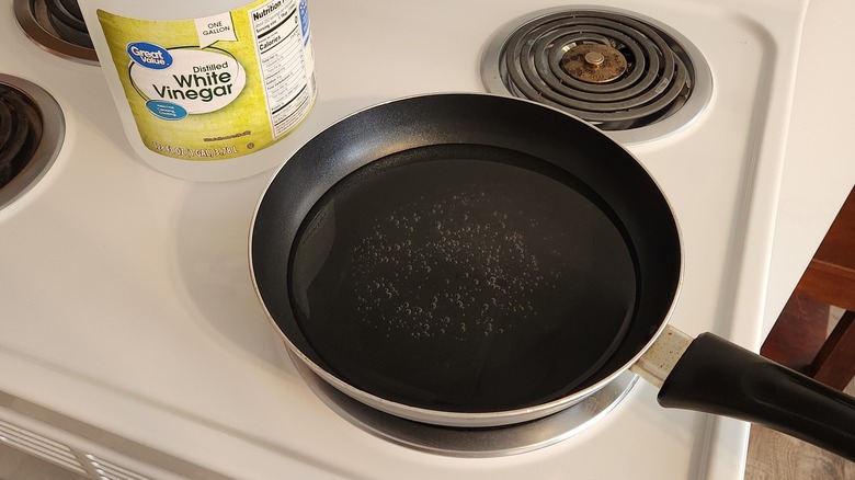 water simmering in black pan