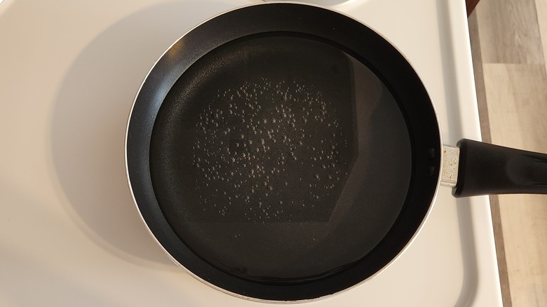 water-filled pan on stove