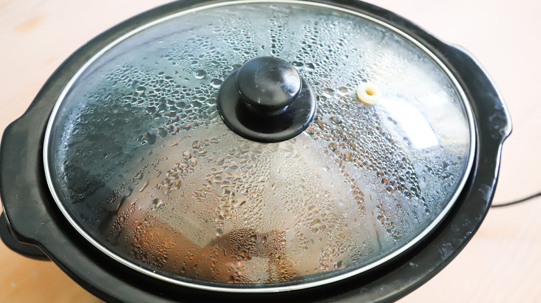 Hot dogs cooking in Crock-Pot