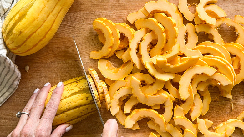 hand cutting the delicata squash