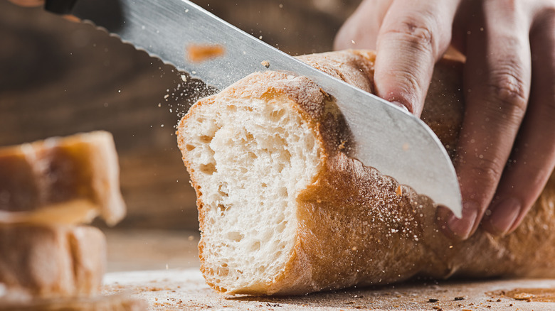 Knife slicing bread on its side