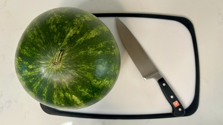 Watermelon, knife, and board