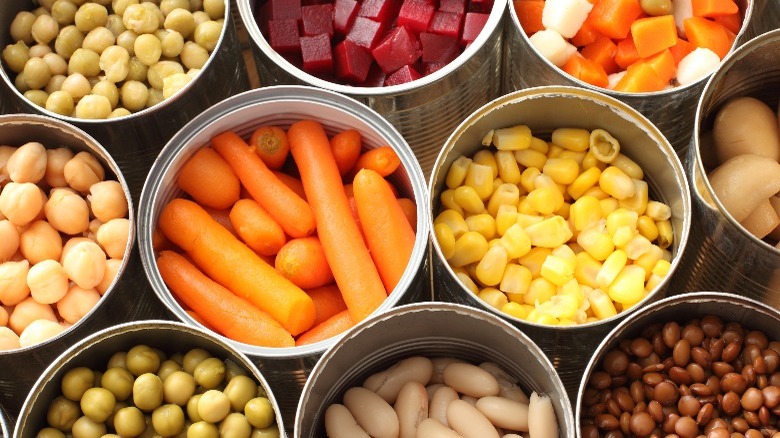 Open cans of drained vegetables