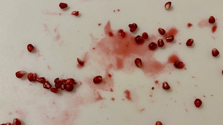 splattered pomegranates and juice