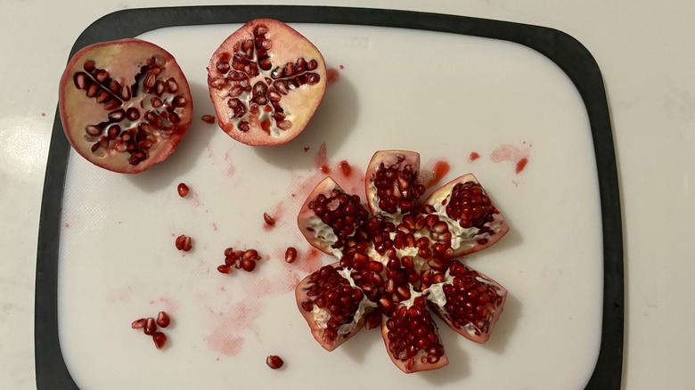 Two pomegranates cut