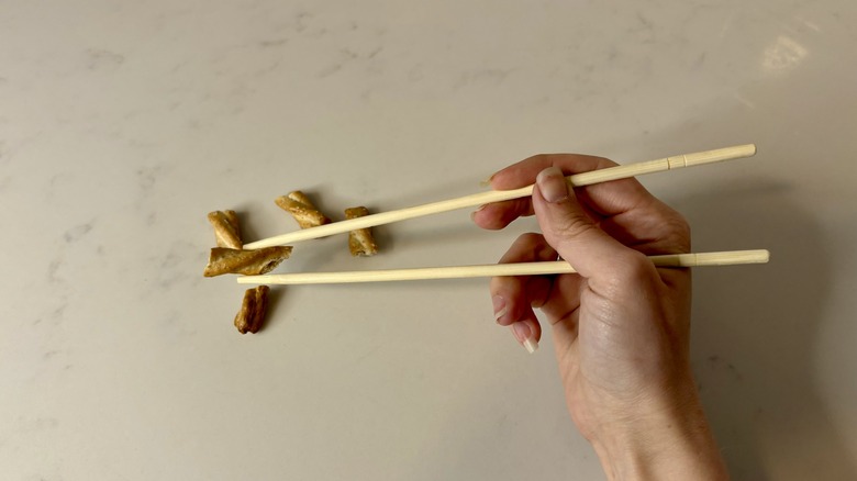 chopsticks holding pretzles