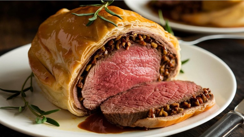 Beef Wellington with rosemary on plate