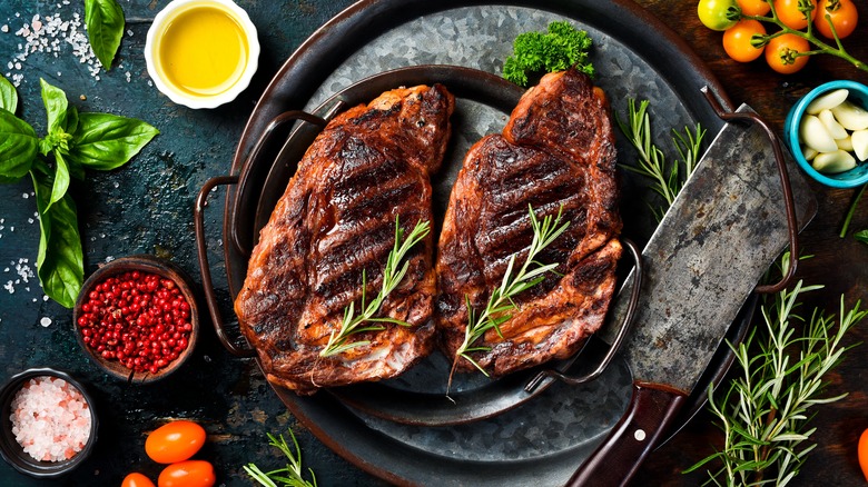 Ribeye steaks on cast iron