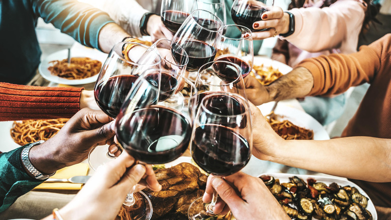 Toasting wine at a dinner party