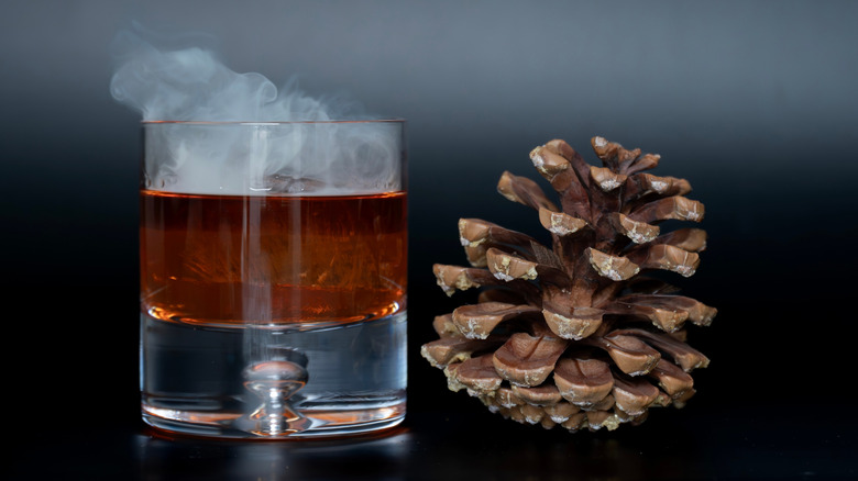 whiskey cocktail with fir cone