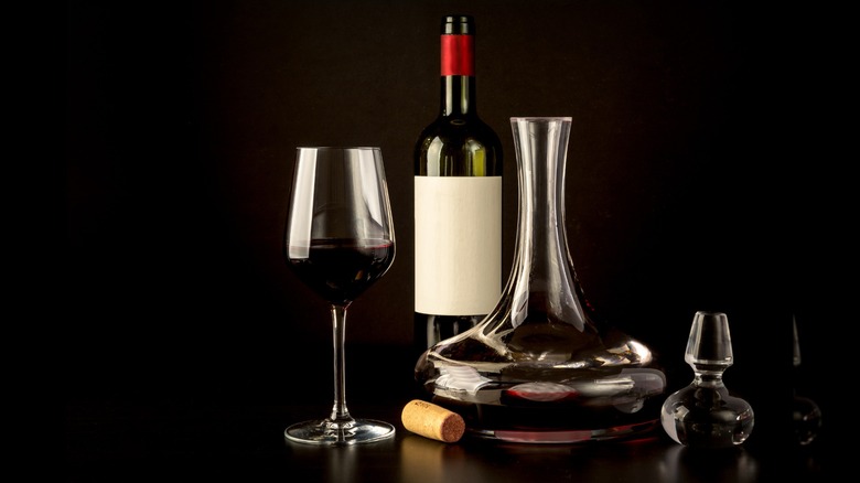 Bottle of wine, wine decanter, and a wine glass