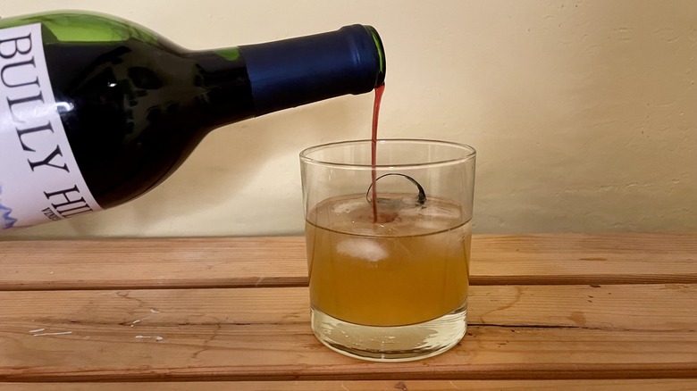 Wine poured into cocktail 