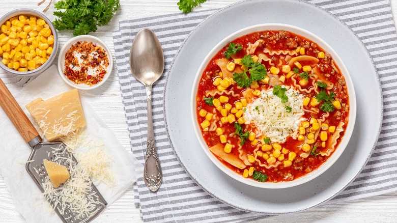 Lasagna soup with corn, parsley, cheese, and red pepper