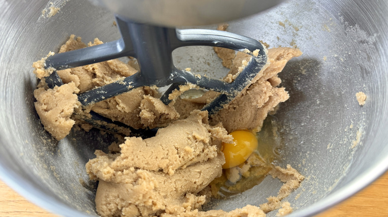 Beating eggs into butter mixture