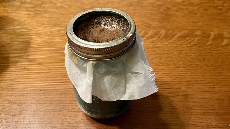 Coffee straining through mason jar