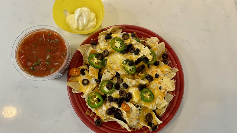 nachos with salsa and sour cream