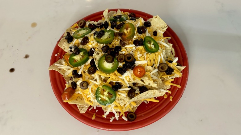 uncooked nachos on plate