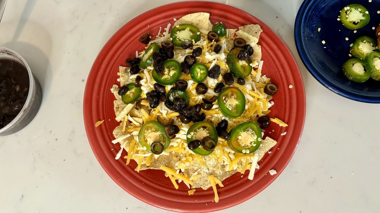 uncooked nachos on plate