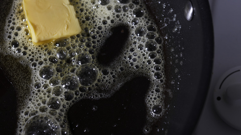 Close up of butter melting in saucepan