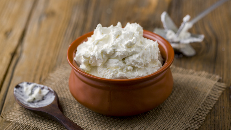 Homemade white butter in clay pot