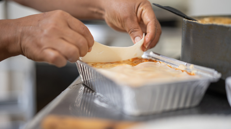 layering fresh lasagna sheets in pan