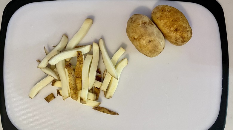 two potatoes, and sliced potatoes 