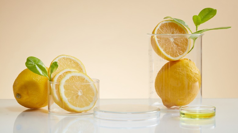 Lemons in glasses with essential oil