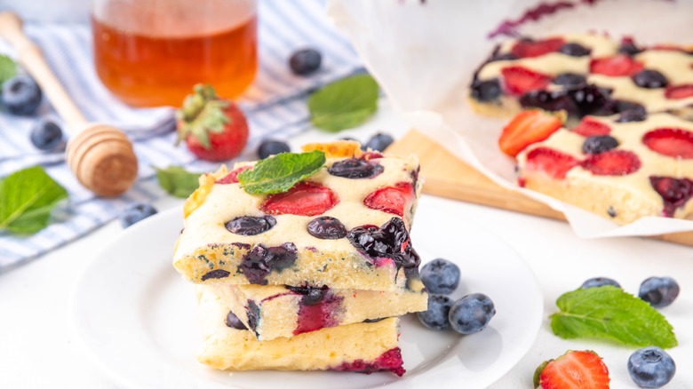 Square pancakes on plate with fruit