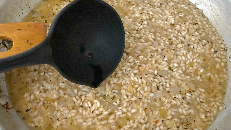 Adding more stock to risotto