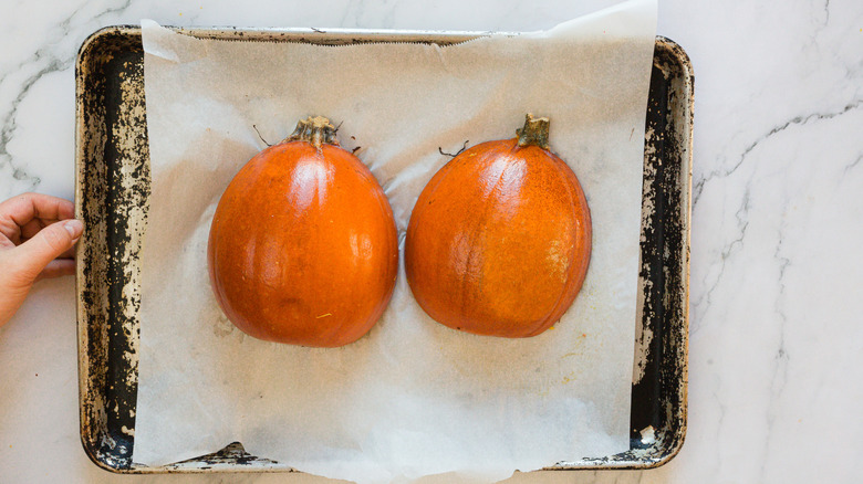 Two baked pumpkin halves