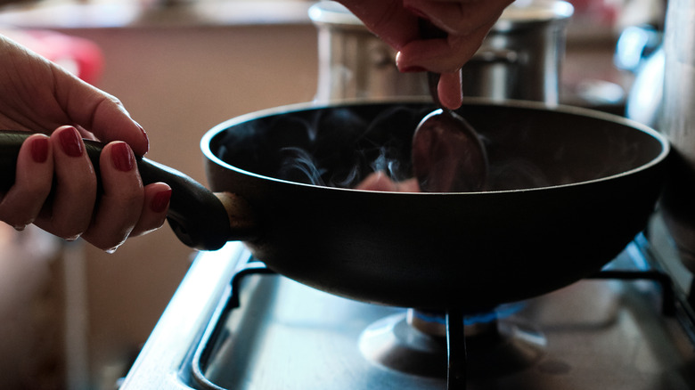 Cooking over a pan on stovetop