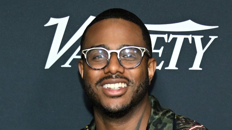 Chef Kwame Onwuachi smiling at an event