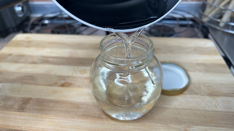 pouring syrup into jar