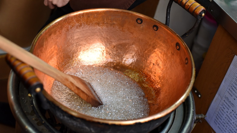 sugar syrup bubbling in a saucepan