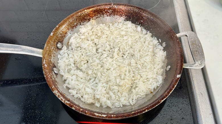 rice spread over pan