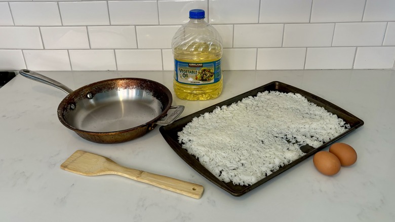 pan, spatula, eggs, oil, rice