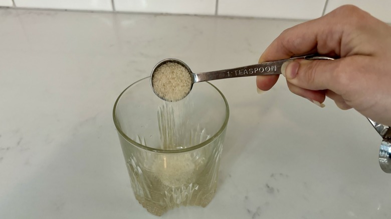 Pouring sugar into cup