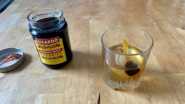 Jar of cherries and a cocktail