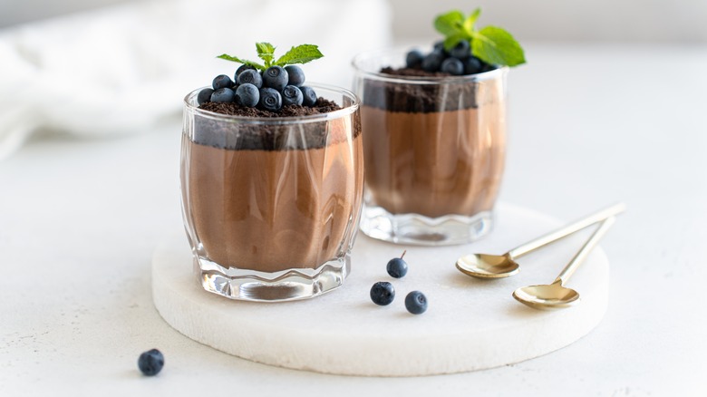 chocolate puddings with berry toppings