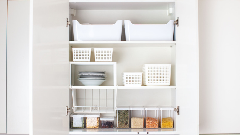 Cubby organizers used for storage in a kitchen cabinet